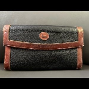 Very well loved vintage Dooney and Bourke wallet
